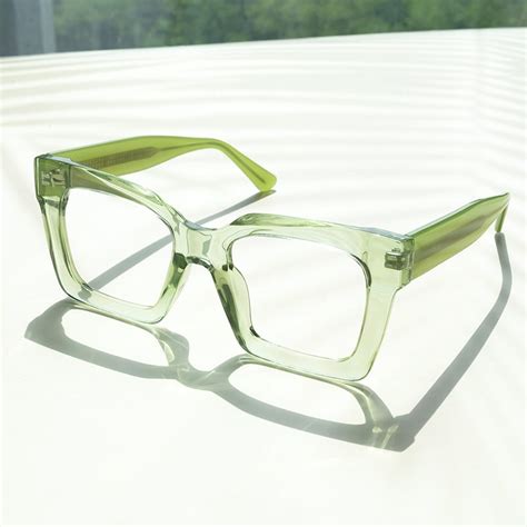 green rectangle glasses.